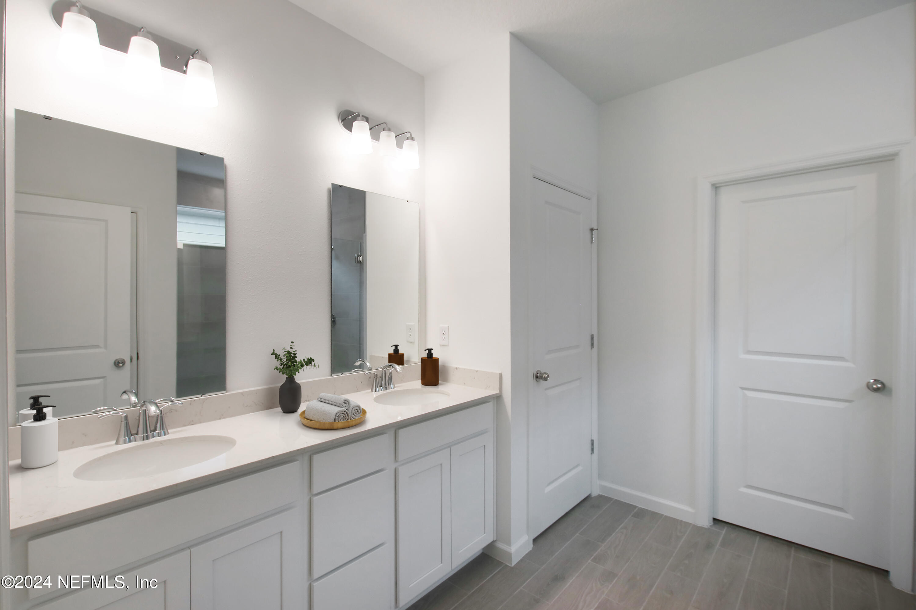 168 Pentwater Road St. Augustine, FL 32092 - Photo 9 of 13 a bathroom with a double vanity sink and mirror