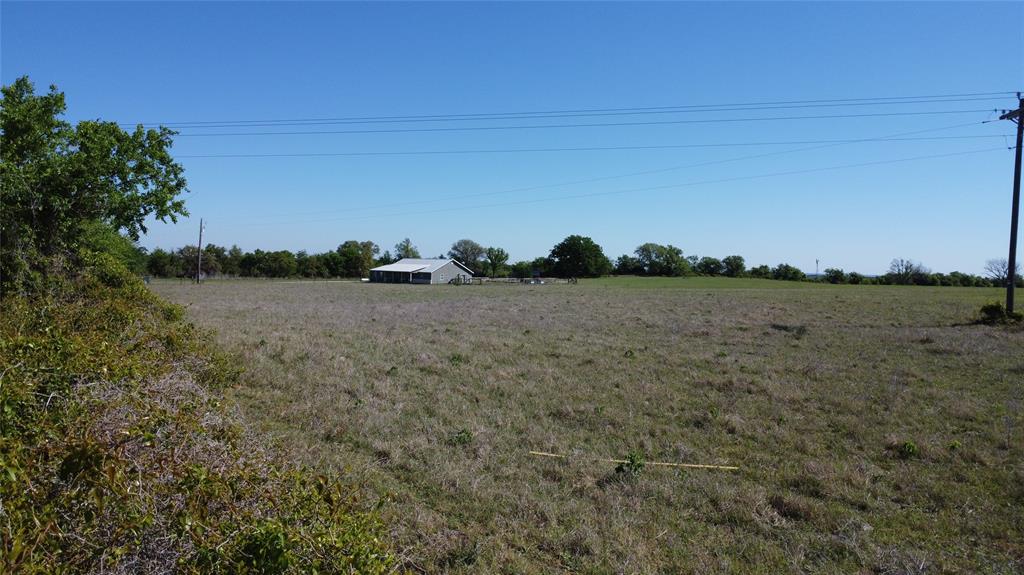 261 County Road 403 Comanche, TX 76442 - Photo 2 of 7 a view of a field with trees in background