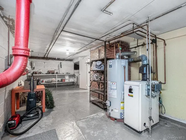 a view of a storage room with water heater and racks