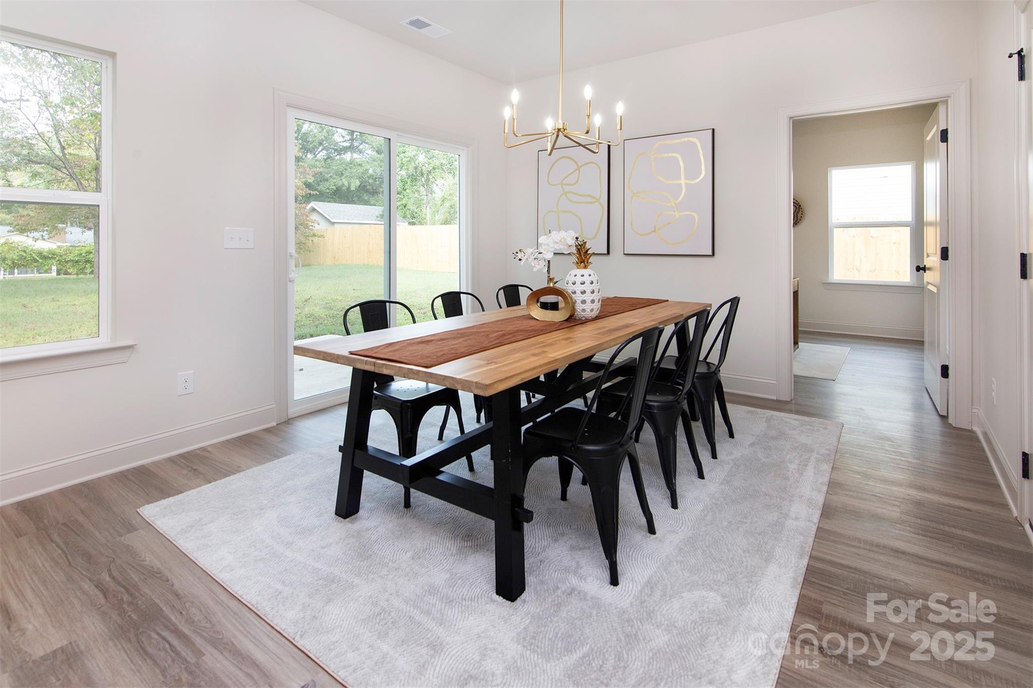 118 Durham Road Stanley, NC 28164 - Photo 11 of 24 a view of a dining room with furniture window and wooden floor