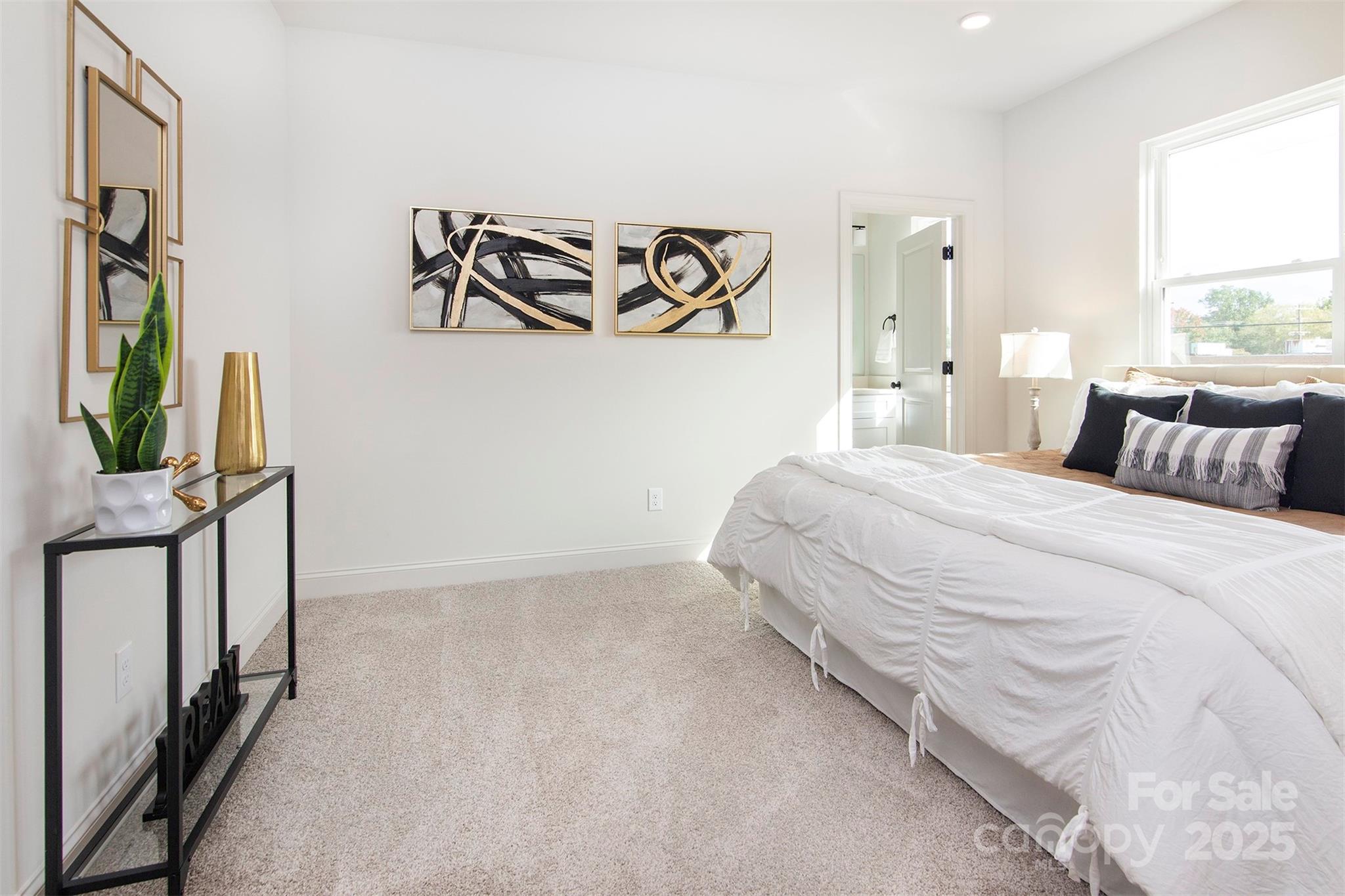 118 Durham Road Stanley, NC 28164 - Photo 17 of 24 a bedroom with a bed and a flat screen tv