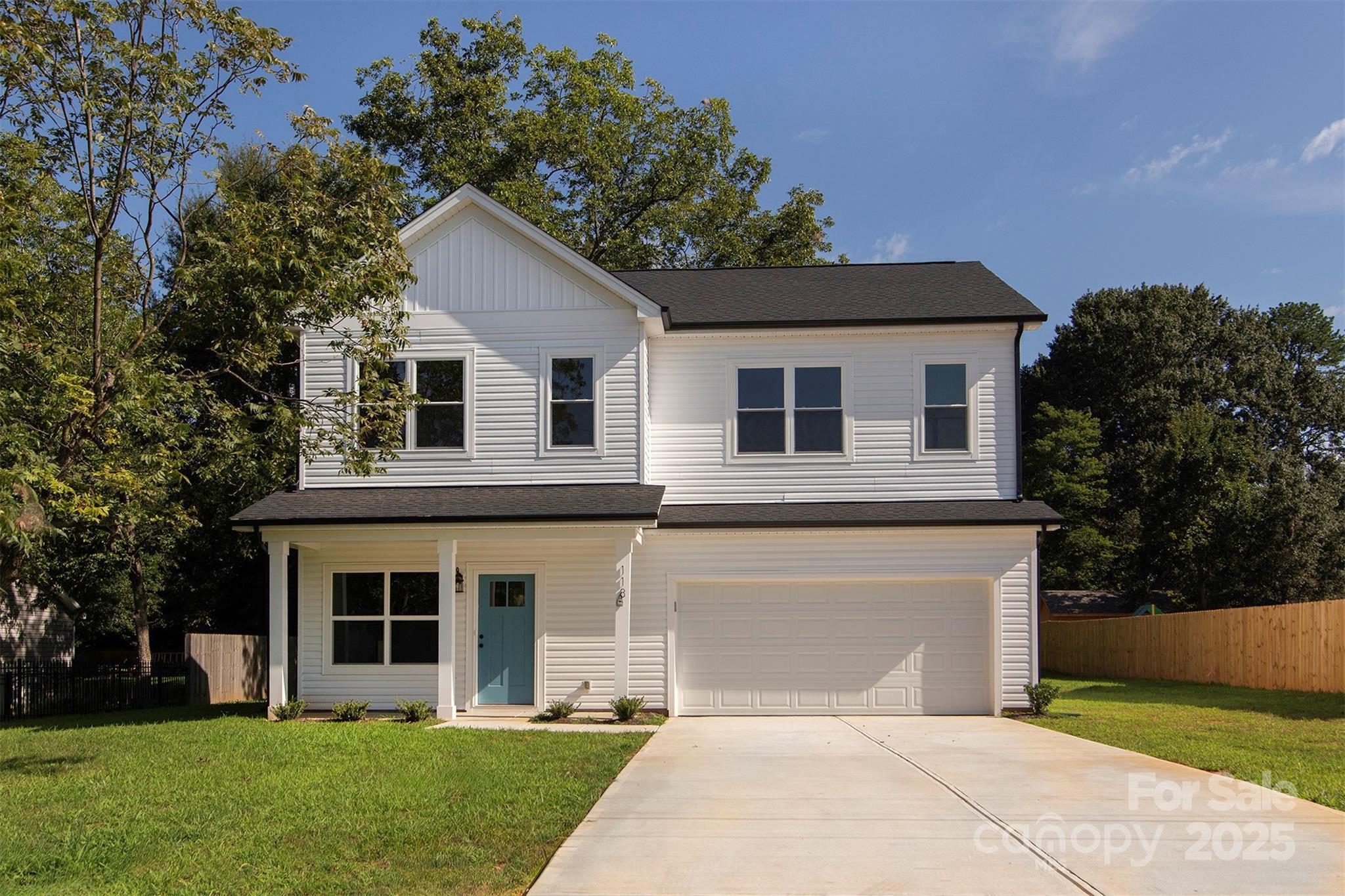 118 Durham Road Stanley, NC 28164 - Photo 24 of 24 a front view of a house with a garden and yard