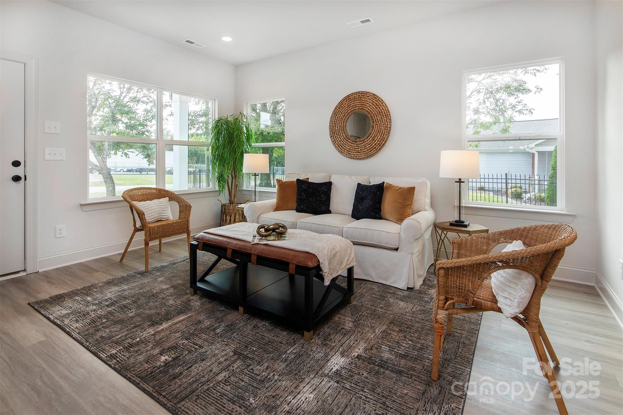 118 Durham Road Stanley, NC 28164 - Photo 5 of 24 a living room with furniture a window and a clock