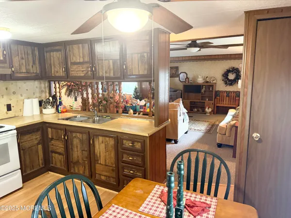 a kitchen with stainless steel appliances granite countertop a sink and cabinets