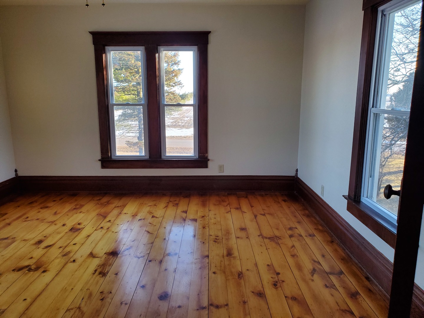 15 North 46th Road Mendota, IL 61342 - Photo 14 of 20 an empty room with wooden floor and windows