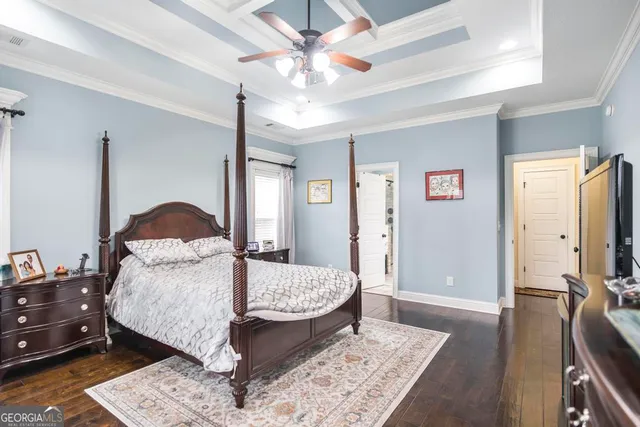 a bed sitting in a room next to a window