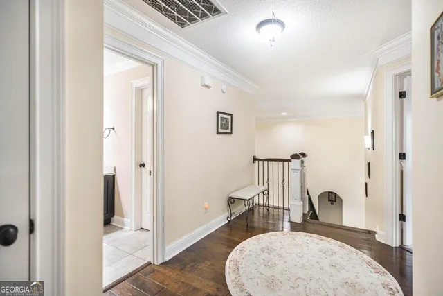 a view of a very nice looking dining room with a table and chairs