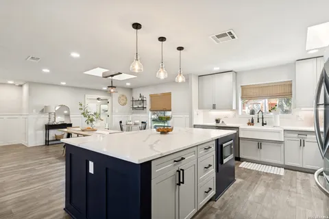 a kitchen with a sink and cabinets