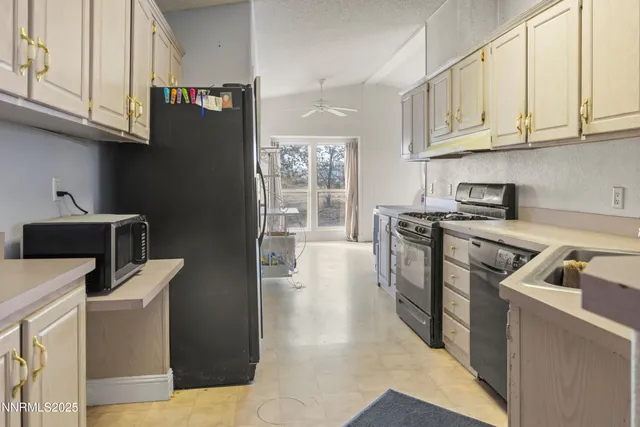 a kitchen with stainless steel appliances granite countertop a stove and a sink