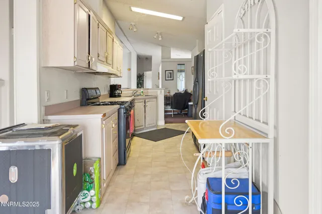 a dining room with furniture and a chandelier