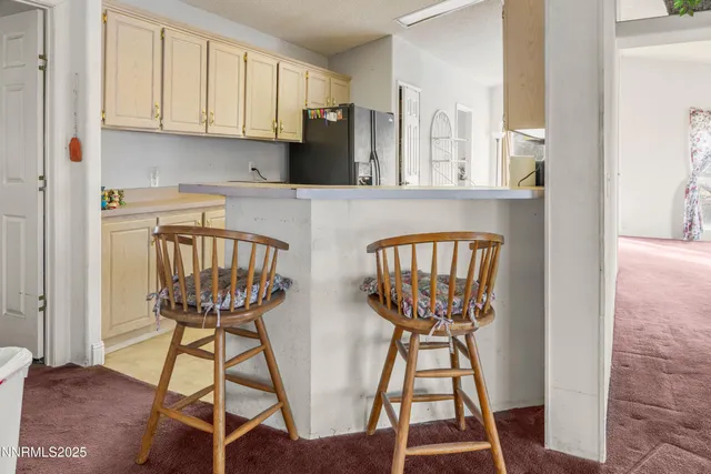 a bed sitting in a room next to a window