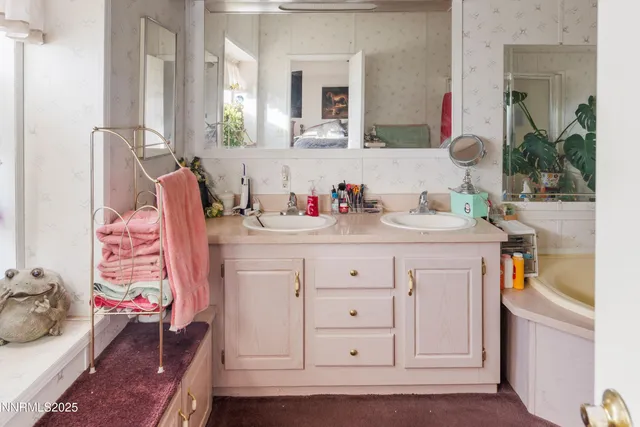 a white bath tub sitting in a bathroom