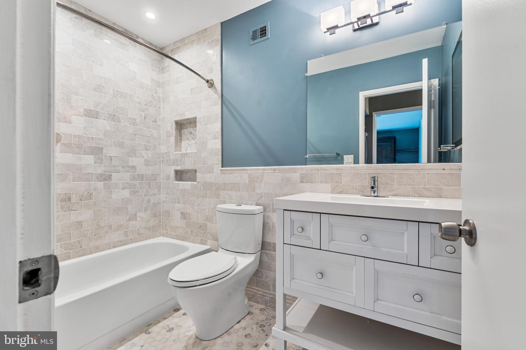 11120 Harbor Court, Unit 1120 Reston, VA 20191 - Photo 13 of 26 a bathroom with a sink a toilet and shower