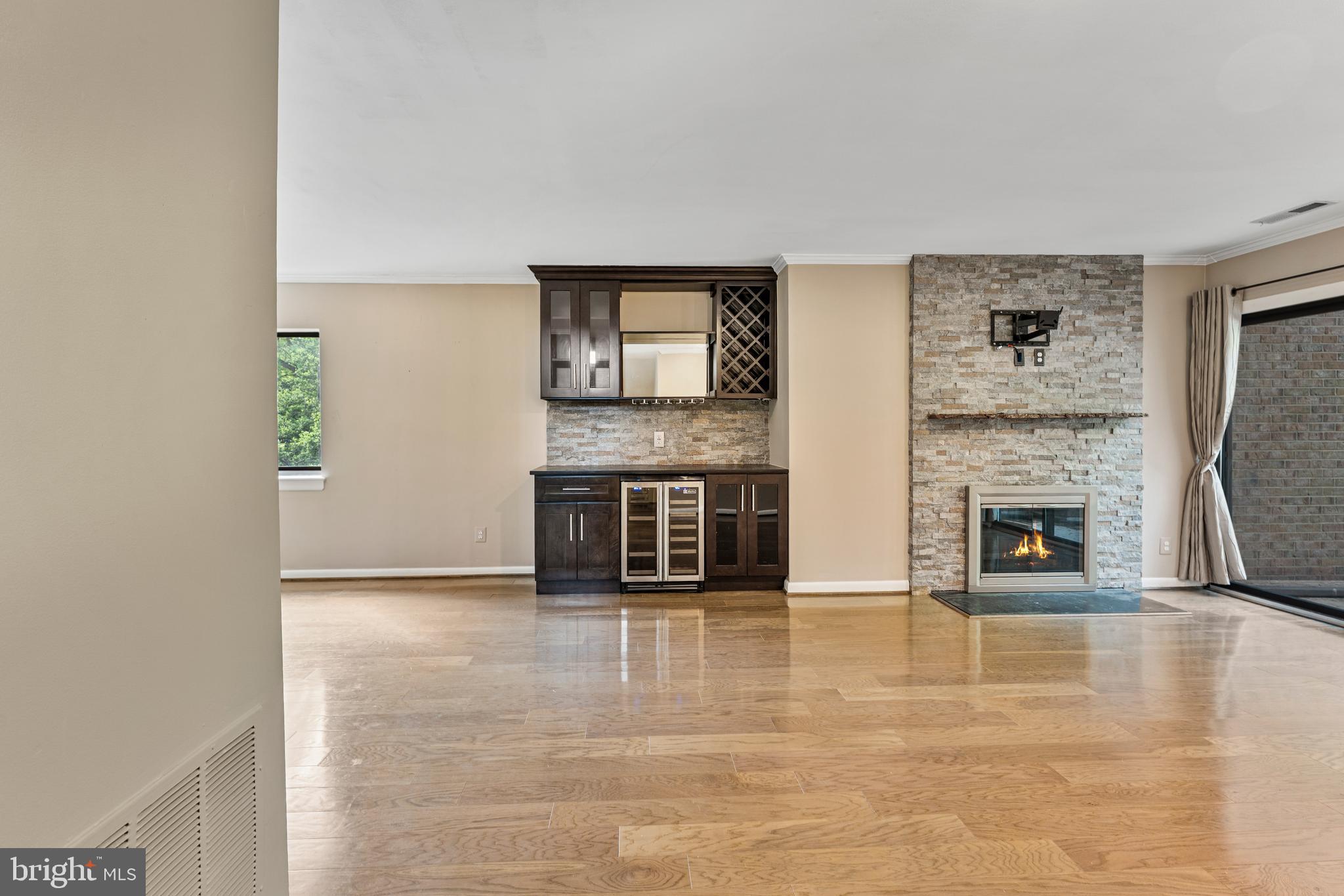 11120 Harbor Court, Unit 1120 Reston, VA 20191 - Photo 15 of 26 a view of a livingroom with a fireplace and window
