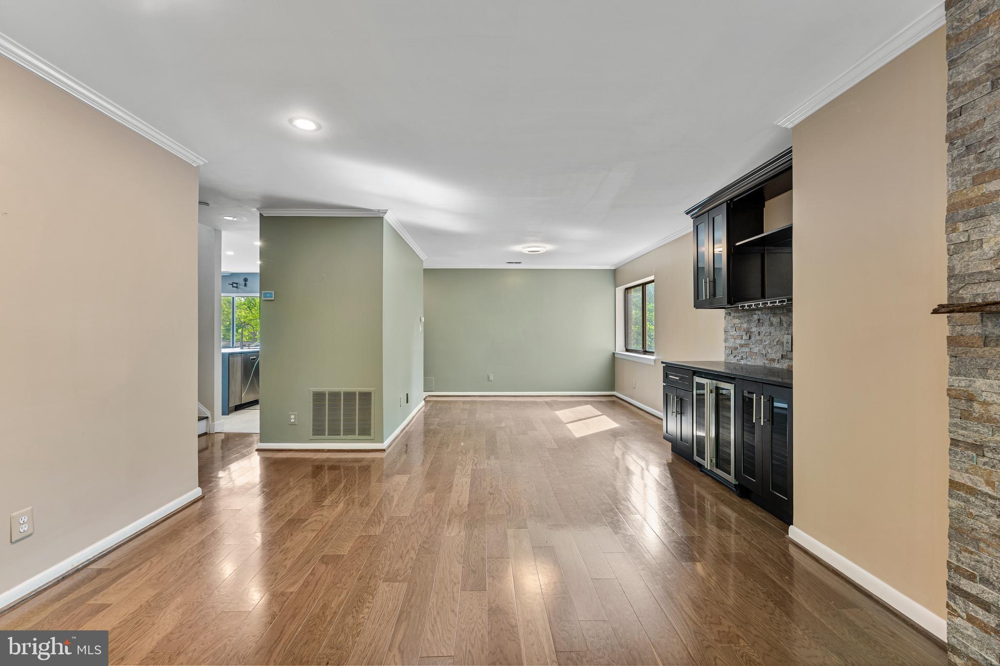 11120 Harbor Court, Unit 1120 Reston, VA 20191 - Photo 20 of 26 a view of empty room with wooden floor and fireplace
