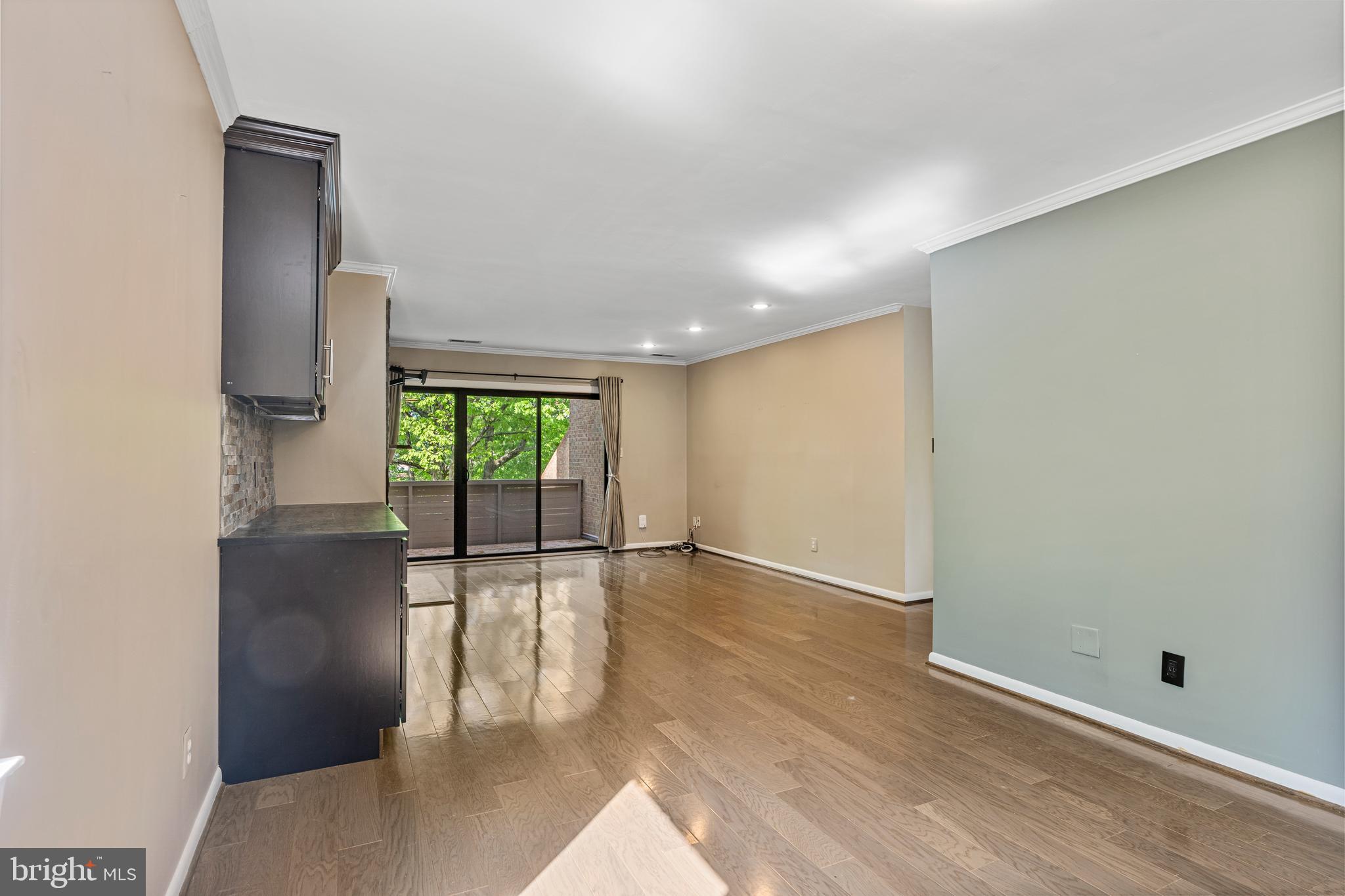 11120 Harbor Court, Unit 1120 Reston, VA 20191 - Photo 23 of 26 an empty room with wooden floor and windows