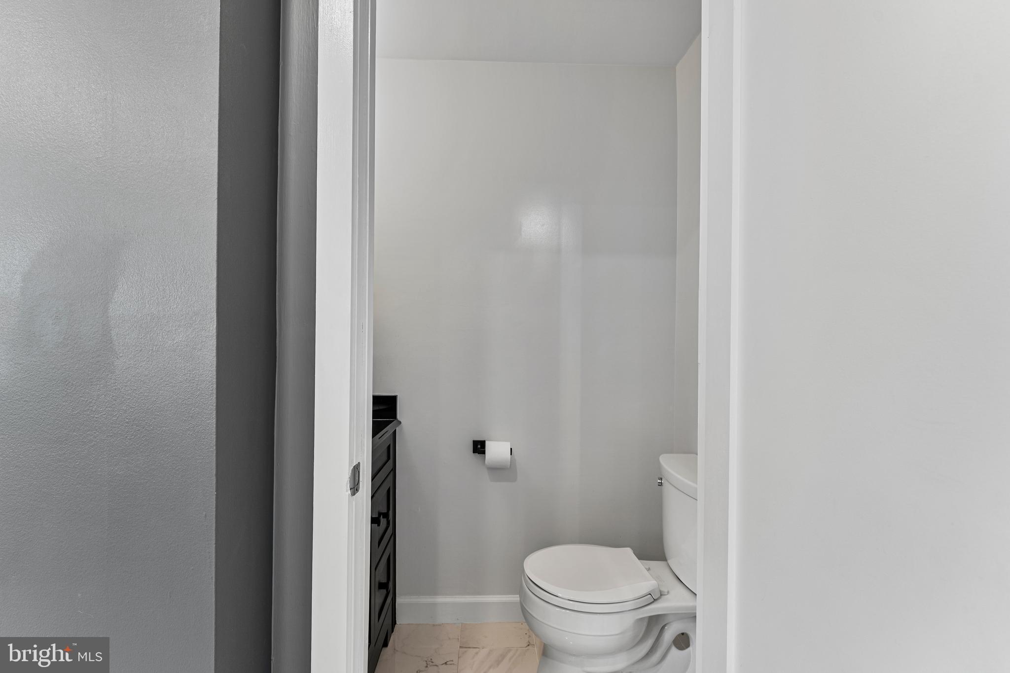 11120 Harbor Court, Unit 1120 Reston, VA 20191 - Photo 25 of 26 a white toilet sitting next to a shower