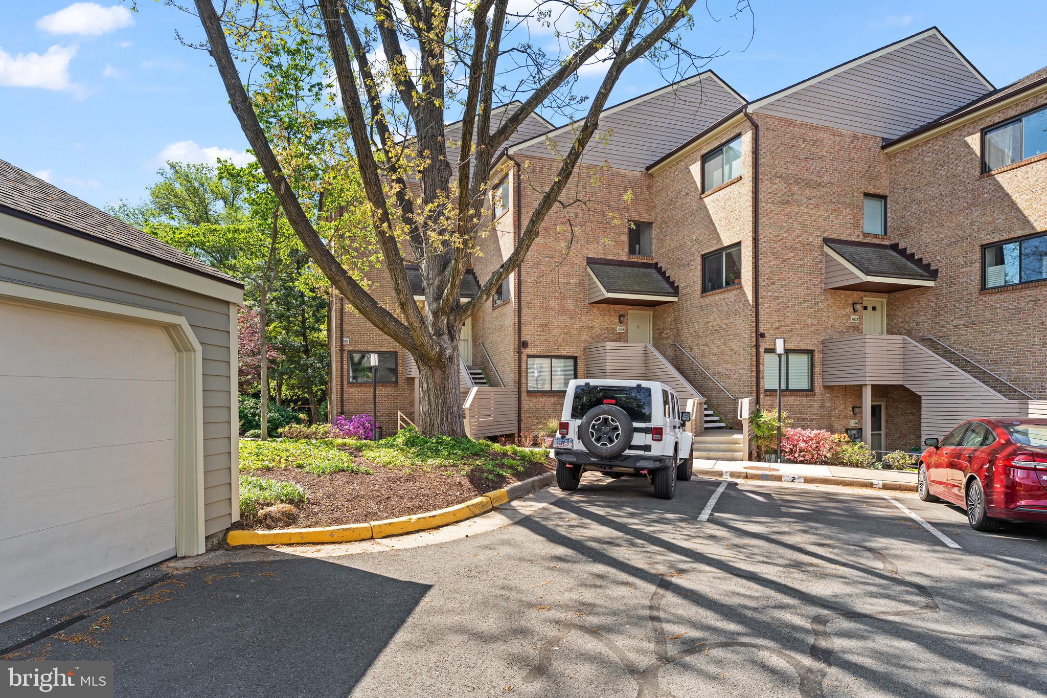 11120 Harbor Court, Unit 1120 Reston, VA 20191 - Photo 26 of 26 a car parked on the side of a street