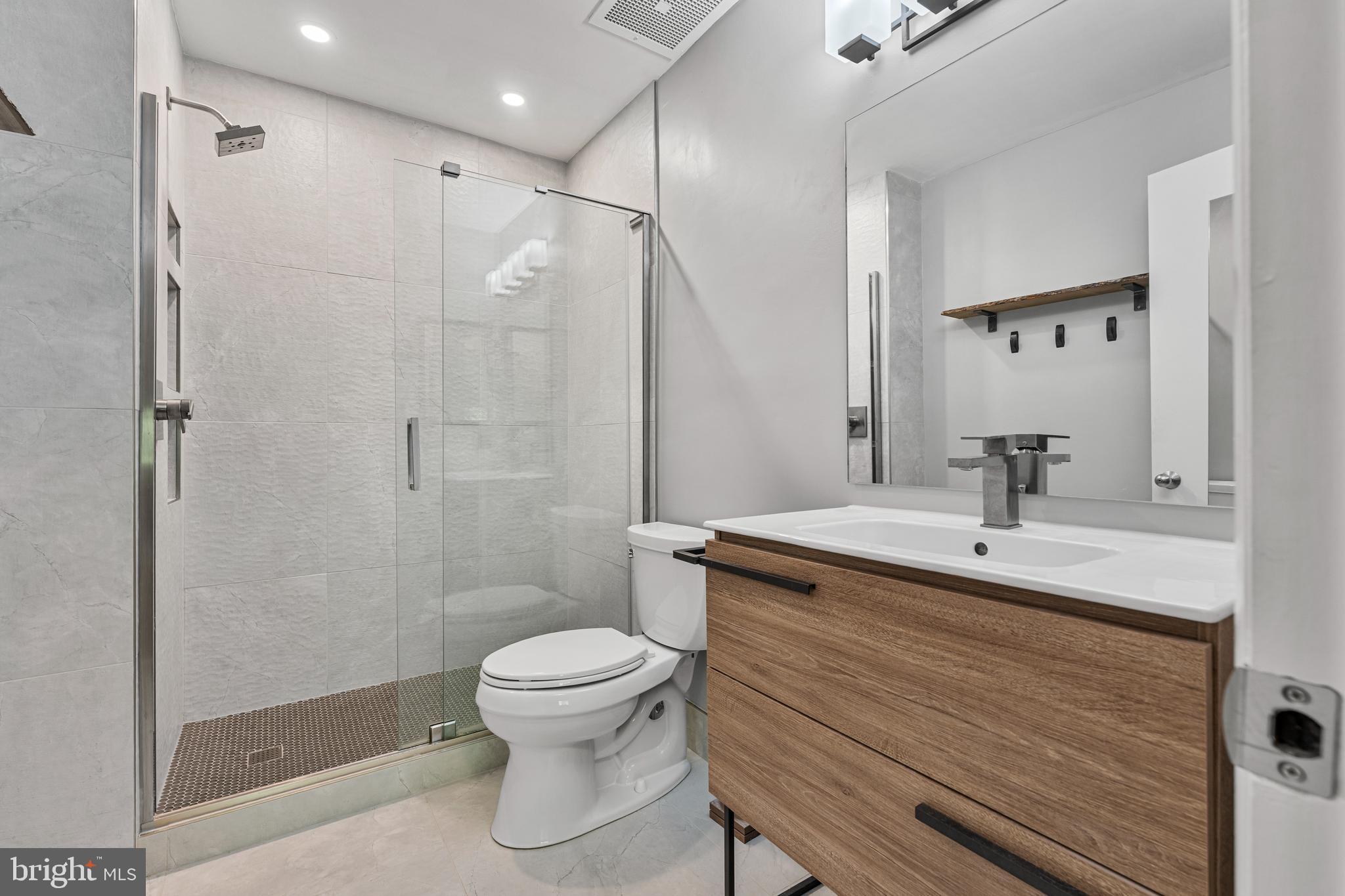 11120 Harbor Court, Unit 1120 Reston, VA 20191 - Photo 9 of 26 a bathroom with a sink a toilet and shower