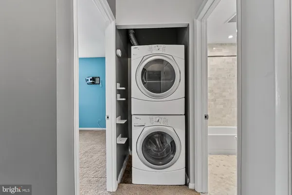 a view of a storage & utility room with washer and dryer