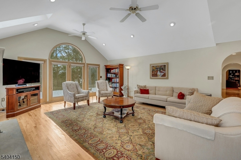 31 Garfield Avenue Madison, NJ 07940 - Photo 12 of 47 a living room with furniture a large window and a flat screen tv