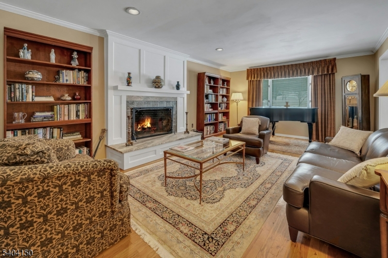 31 Garfield Avenue Madison, NJ 07940 - Photo 13 of 47 a living room with furniture and a fireplace