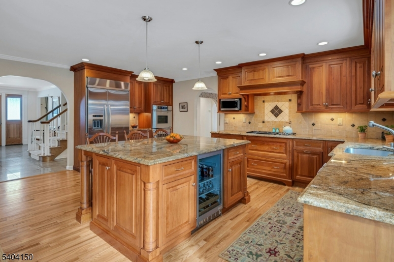 31 Garfield Avenue Madison, NJ 07940 - Photo 18 of 47 a kitchen with stainless steel appliances granite countertop a stove a sink and a refrigerator