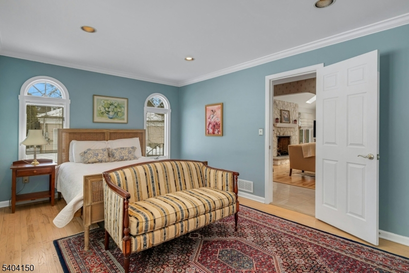 31 Garfield Avenue Madison, NJ 07940 - Photo 21 of 47 a bedroom with a bed and wooden floor