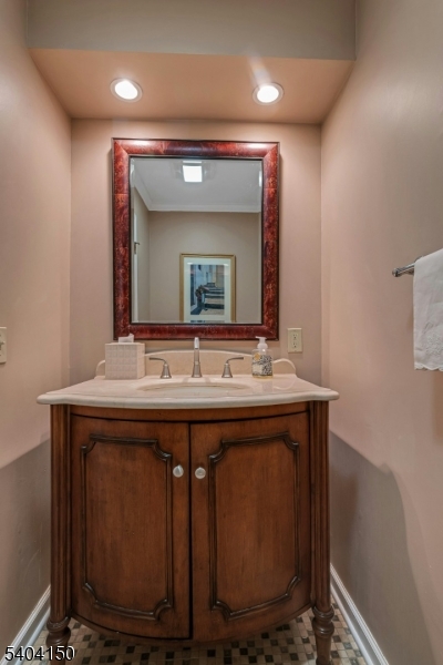 31 Garfield Avenue Madison, NJ 07940 - Photo 23 of 47 a bathroom with a sink vanity and mirror