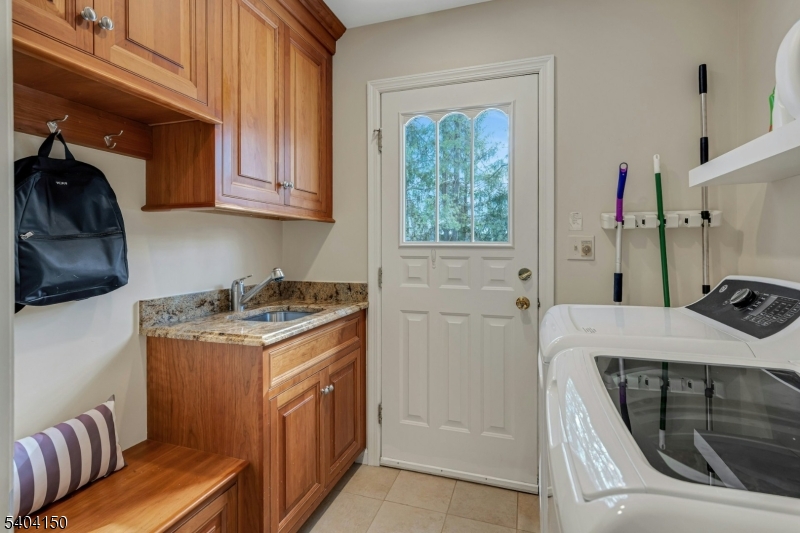 31 Garfield Avenue Madison, NJ 07940 - Photo 24 of 47 a utility room with a sink a washer and dryer