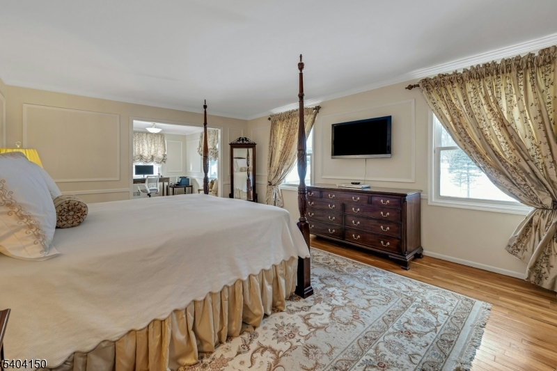 31 Garfield Avenue Madison, NJ 07940 - Photo 26 of 47 a bedroom with a bed and a television