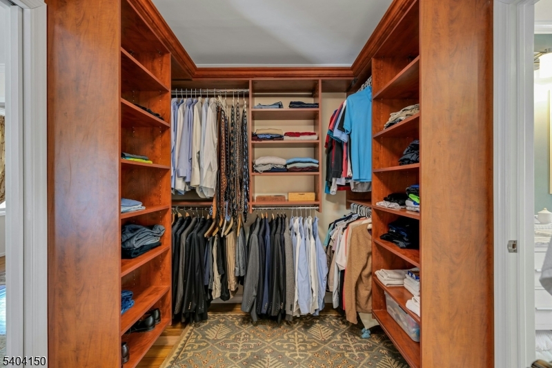 31 Garfield Avenue Madison, NJ 07940 - Photo 28 of 47 a view of walk in closet with clothes and shoes