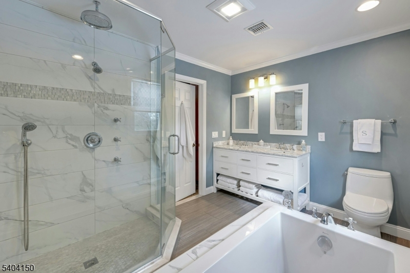 31 Garfield Avenue Madison, NJ 07940 - Photo 30 of 47 a bathroom with a granite countertop sink mirror vanity and toilet