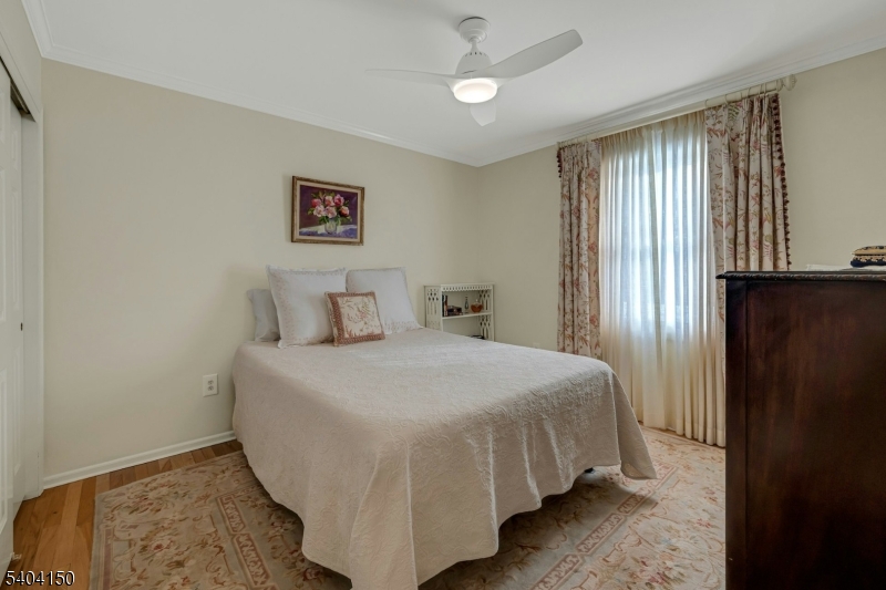 31 Garfield Avenue Madison, NJ 07940 - Photo 33 of 47 a bedroom with a bed and a window