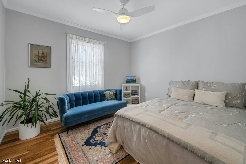 31 Garfield Avenue Madison, NJ 07940 - Photo 35 of 47 a bedroom with a bed couch and window