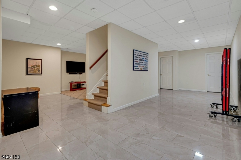 31 Garfield Avenue Madison, NJ 07940 - Photo 39 of 47 a view of kitchen with furniture and a projector screen