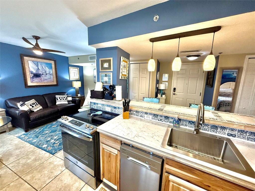 32 South Fletcher Avenue, Unit 105 Fernandina Beach, FL 32034 - Photo 3 of 16 a kitchen with a stove and a sink