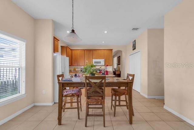 5120 Shale Ridge Trail Orlando, FL 32818 - Photo 6 of 15 a view of a dining room with furniture window and outside view