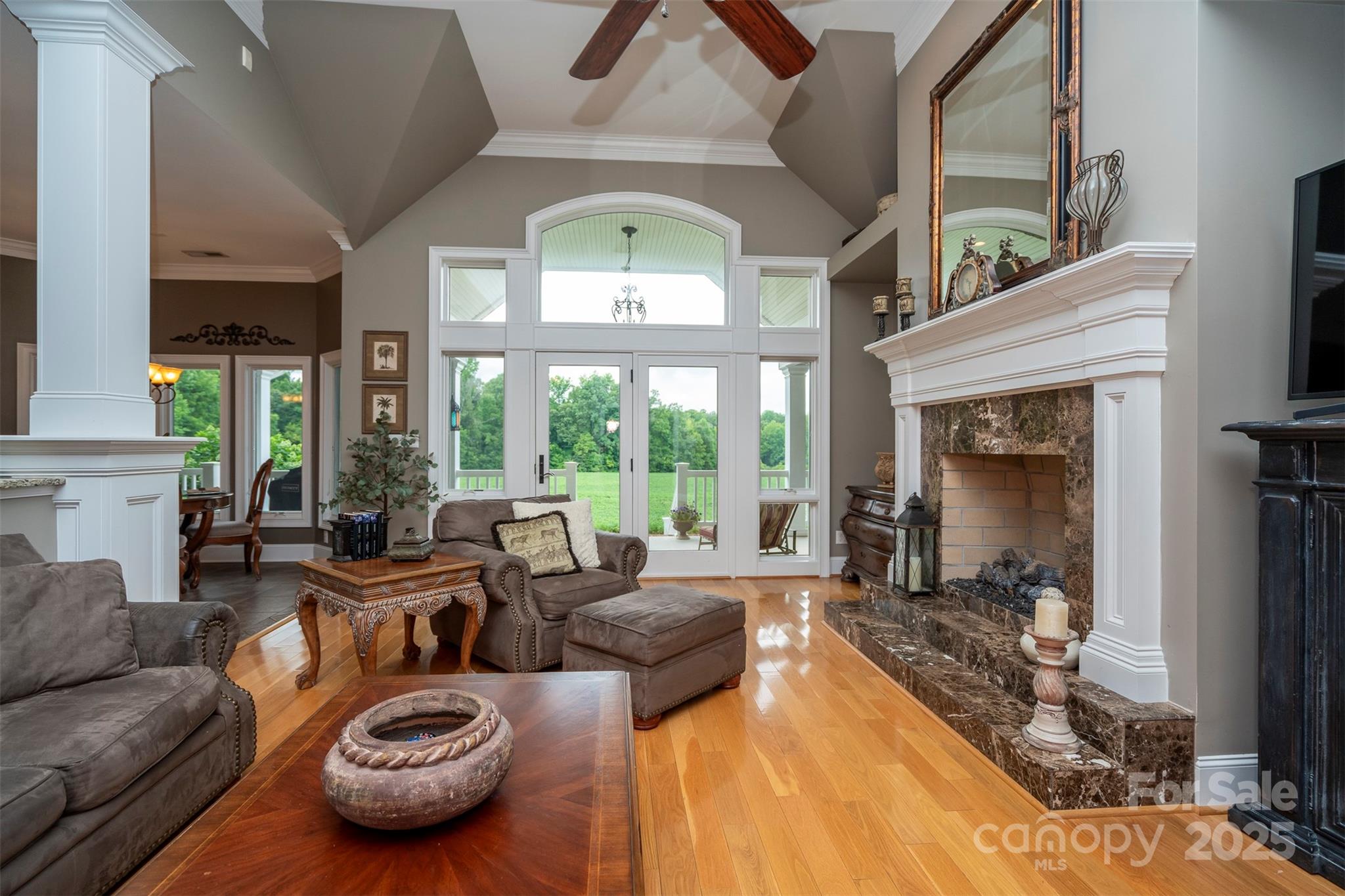 8340 Highway 801 Mount Ulla, NC 28125 - Photo 14 of 47 a living room with furniture fireplace and a large window