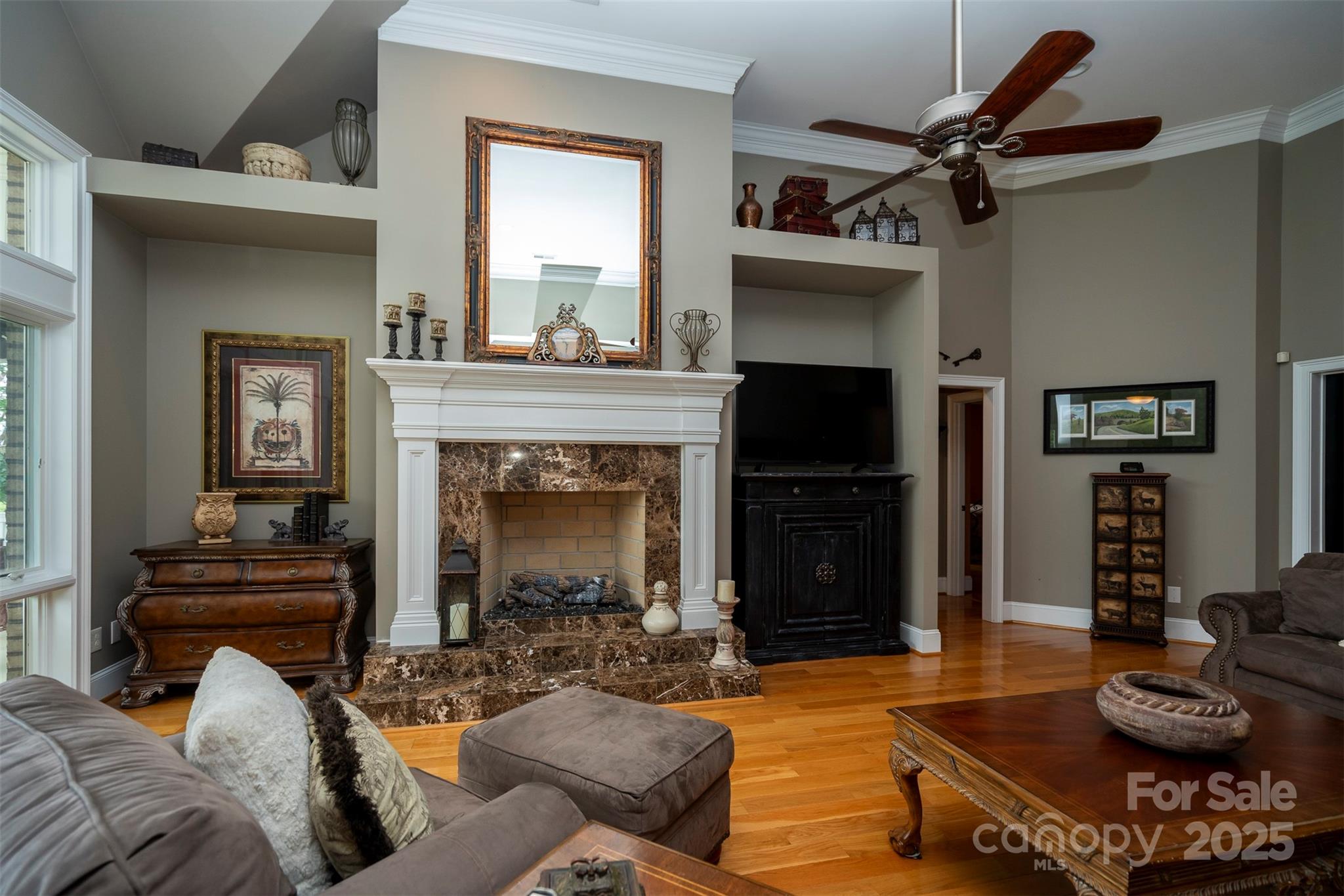 8340 Highway 801 Mount Ulla, NC 28125 - Photo 18 of 47 a living room with furniture a flat screen tv and a fireplace
