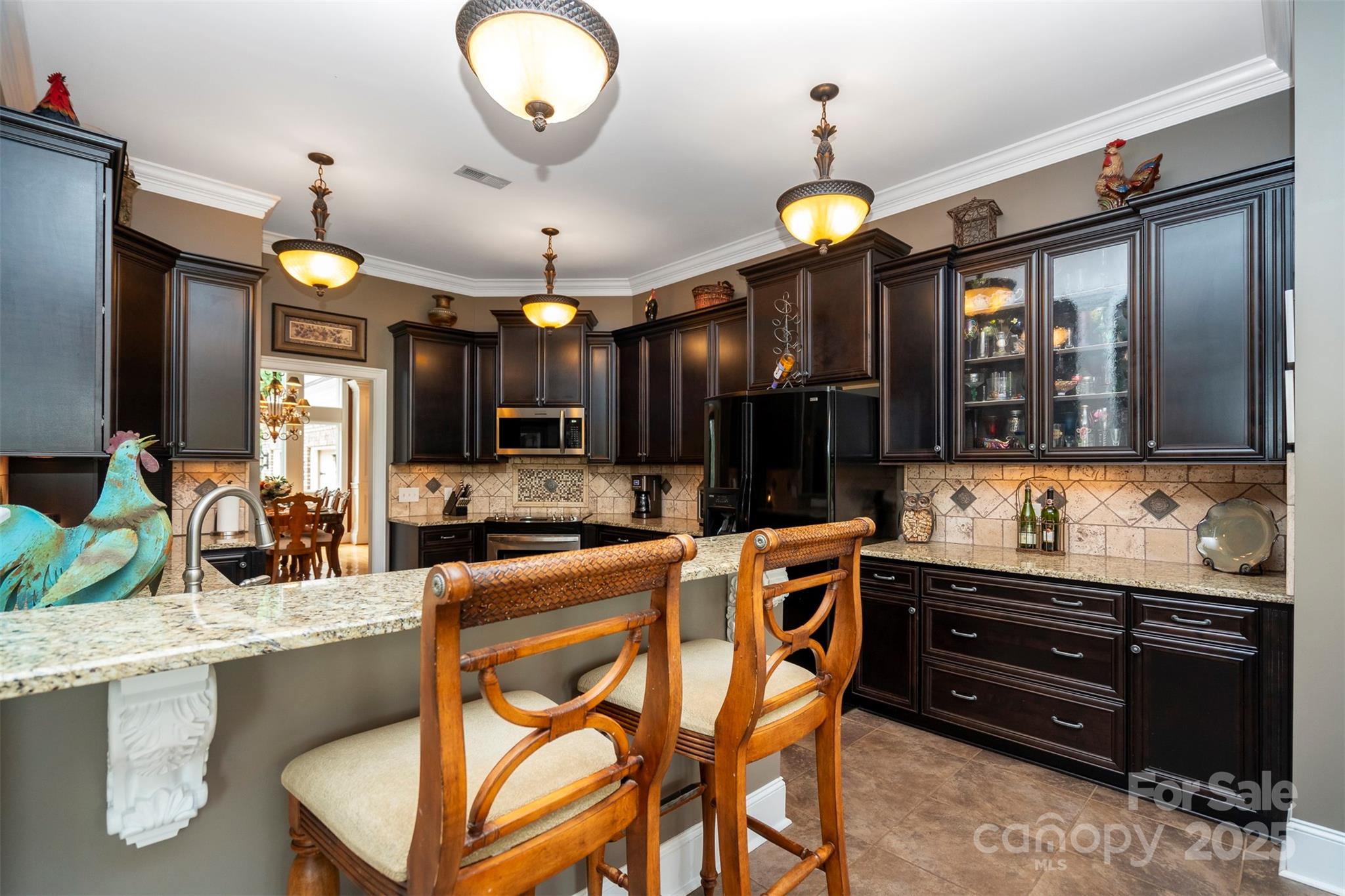 8340 Highway 801 Mount Ulla, NC 28125 - Photo 21 of 47 a kitchen with stainless steel appliances granite countertop a stove a sink and a refrigerator