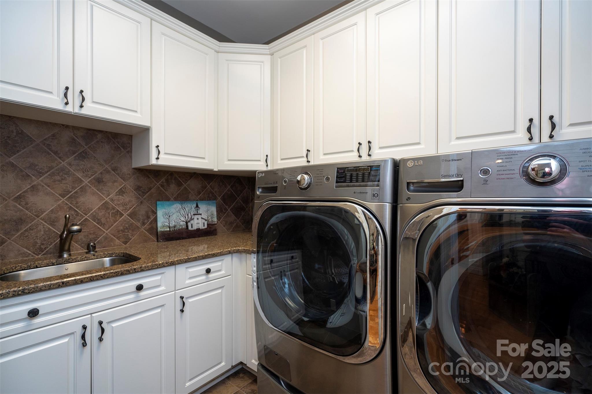 8340 Highway 801 Mount Ulla, NC 28125 - Photo 41 of 47 a utility room with sink dryer and washer