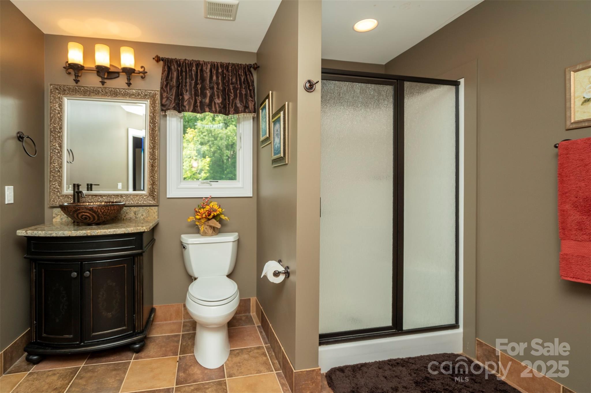 8340 Highway 801 Mount Ulla, NC 28125 - Photo 42 of 47 a bathroom with a granite countertop sink toilet and shower