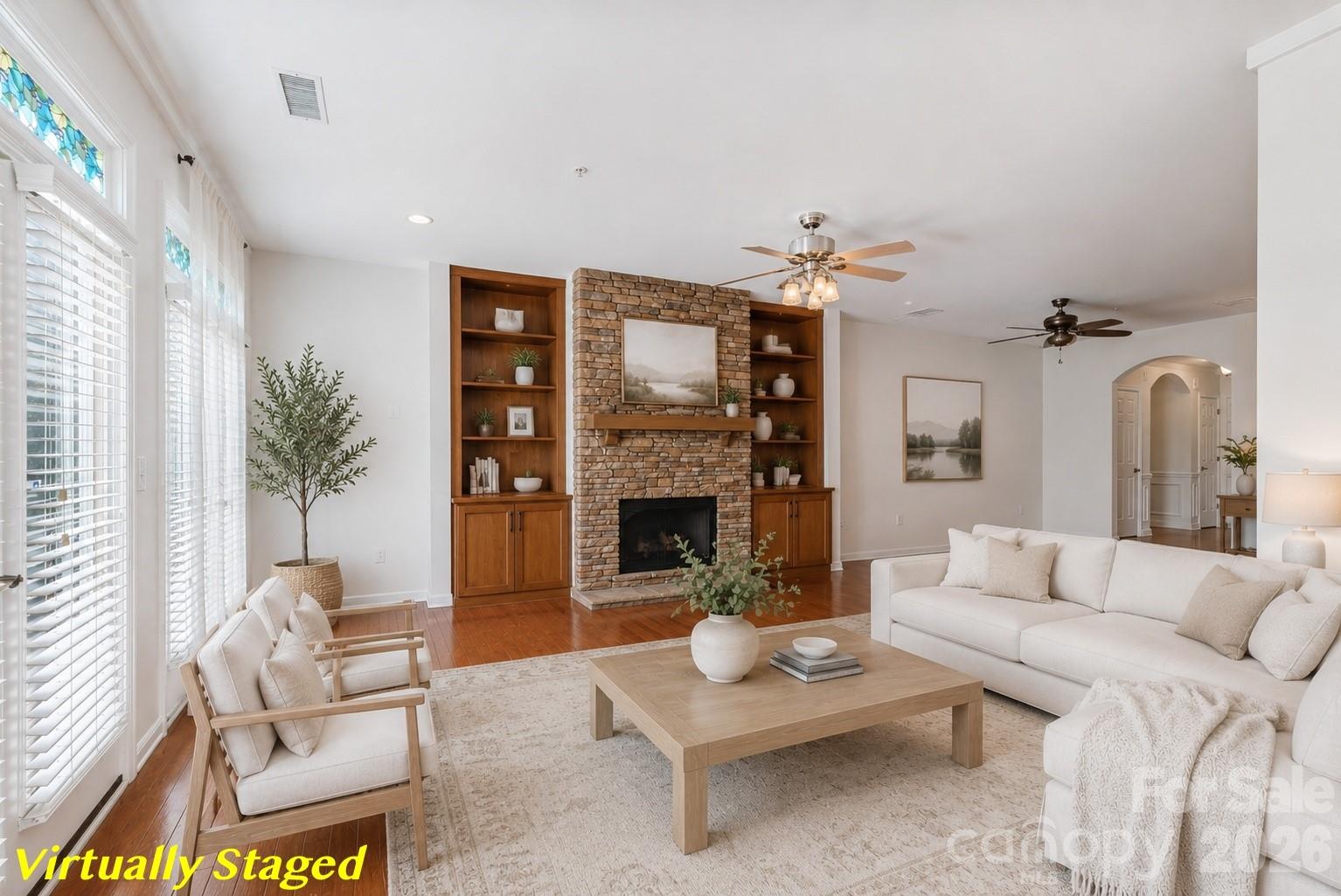 114 Inlet Point Drive Tega Cay, SC 29708 - Photo 10 of 40 a living room with furniture a fireplace and a flat screen tv