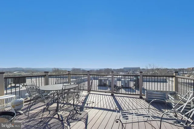a view of a balcony with wooden floor
