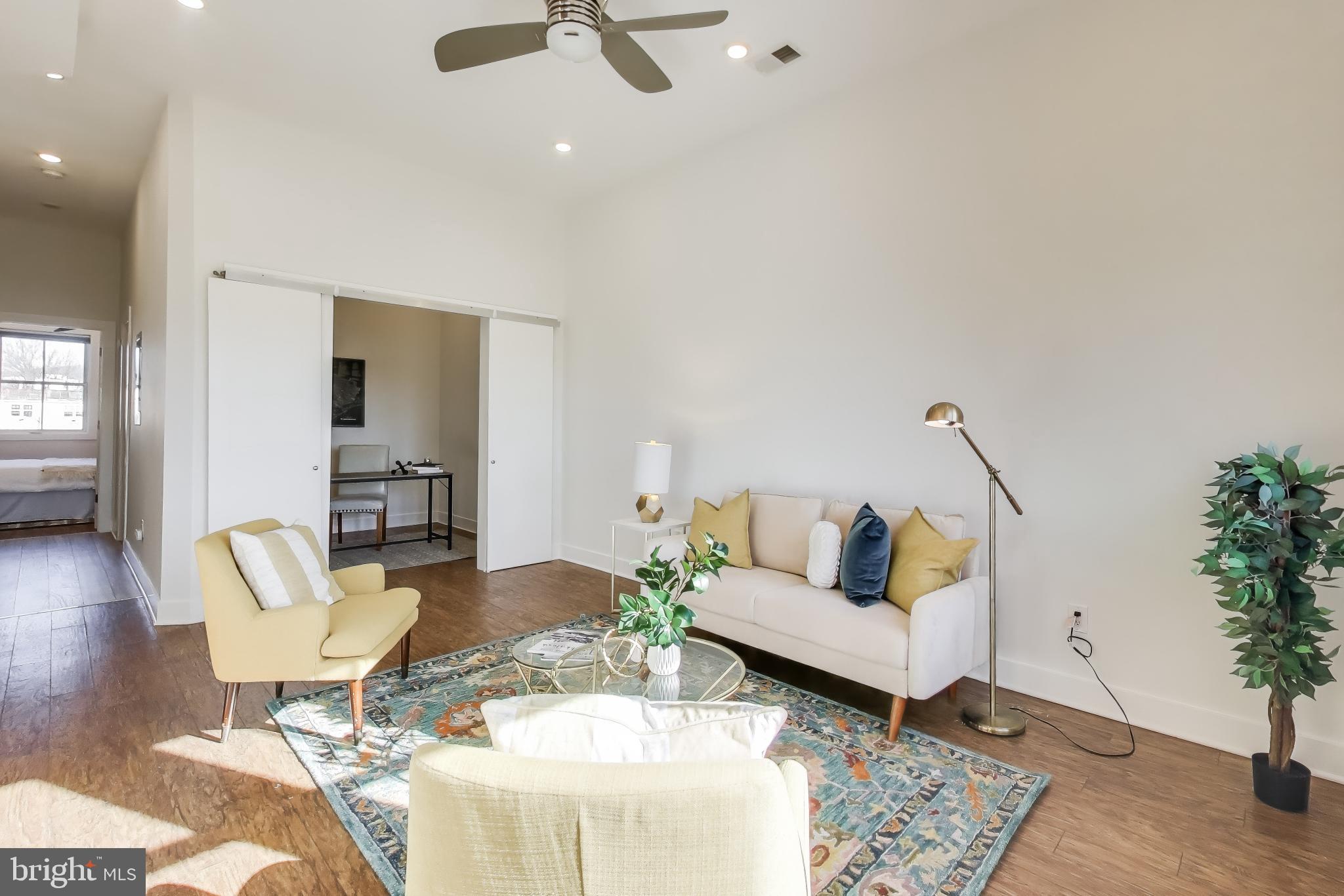 2012 D Street Northeast, Unit 4 Washington, DC 20002 - Photo 9 of 25 a living room with furniture and wooden floor