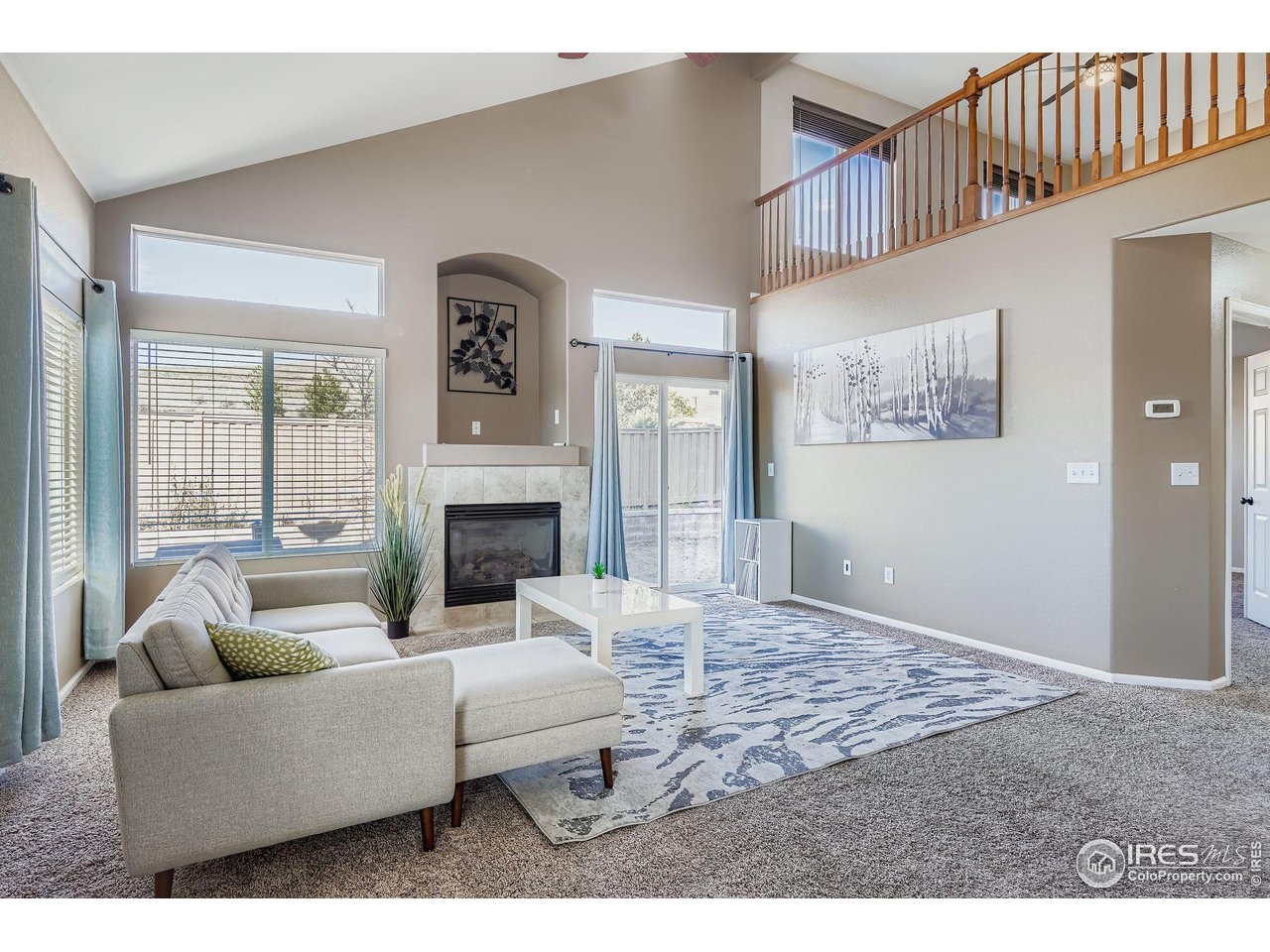 2011 Alpine Drive Erie, CO 80516 - Photo 2 of 21 a living room with furniture fireplace and a window