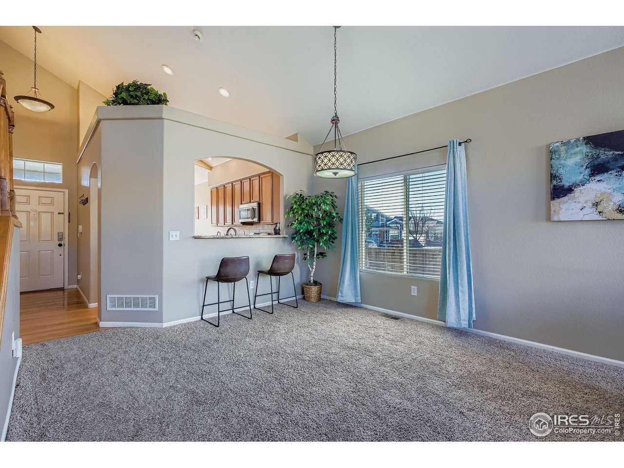 2011 Alpine Drive Erie, CO 80516 - Photo 7 of 21 a view of livingroom with furniture chandelier and window