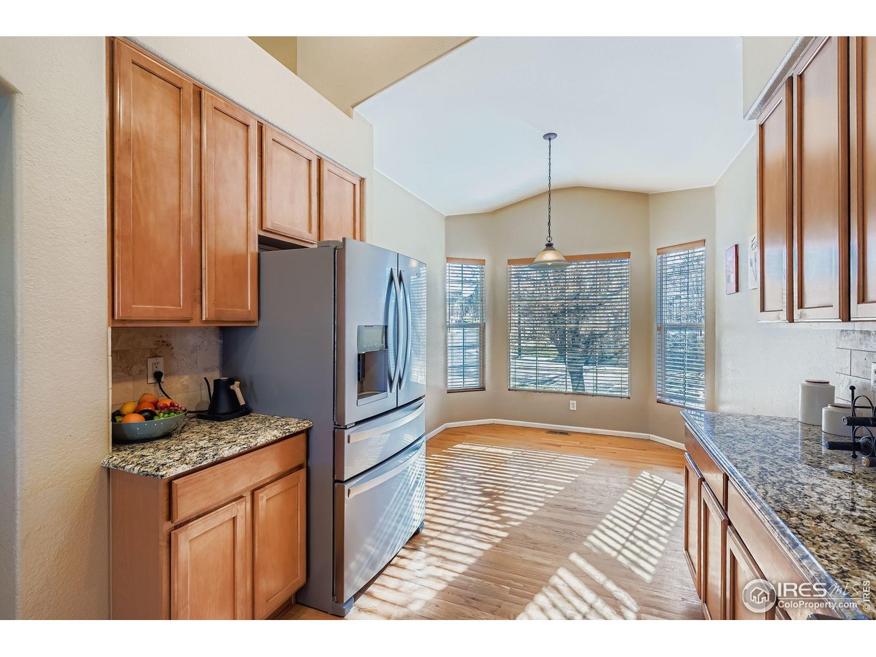 2011 Alpine Drive Erie, CO 80516 - Photo 8 of 21 a kitchen with stainless steel appliances granite countertop a refrigerator sink and cabinets