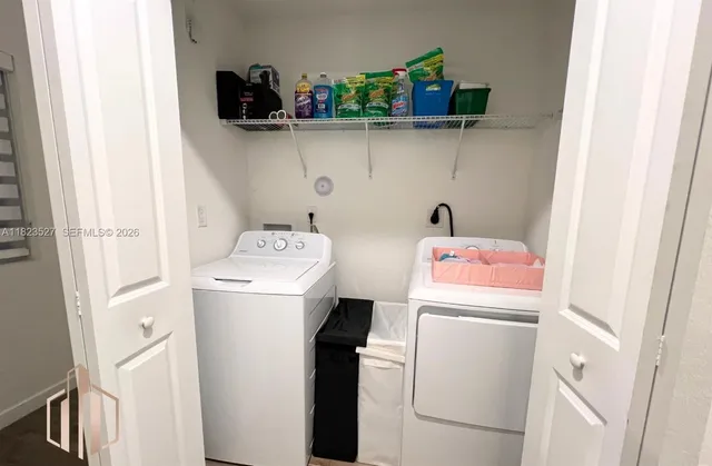 a utility room with dryer and washer